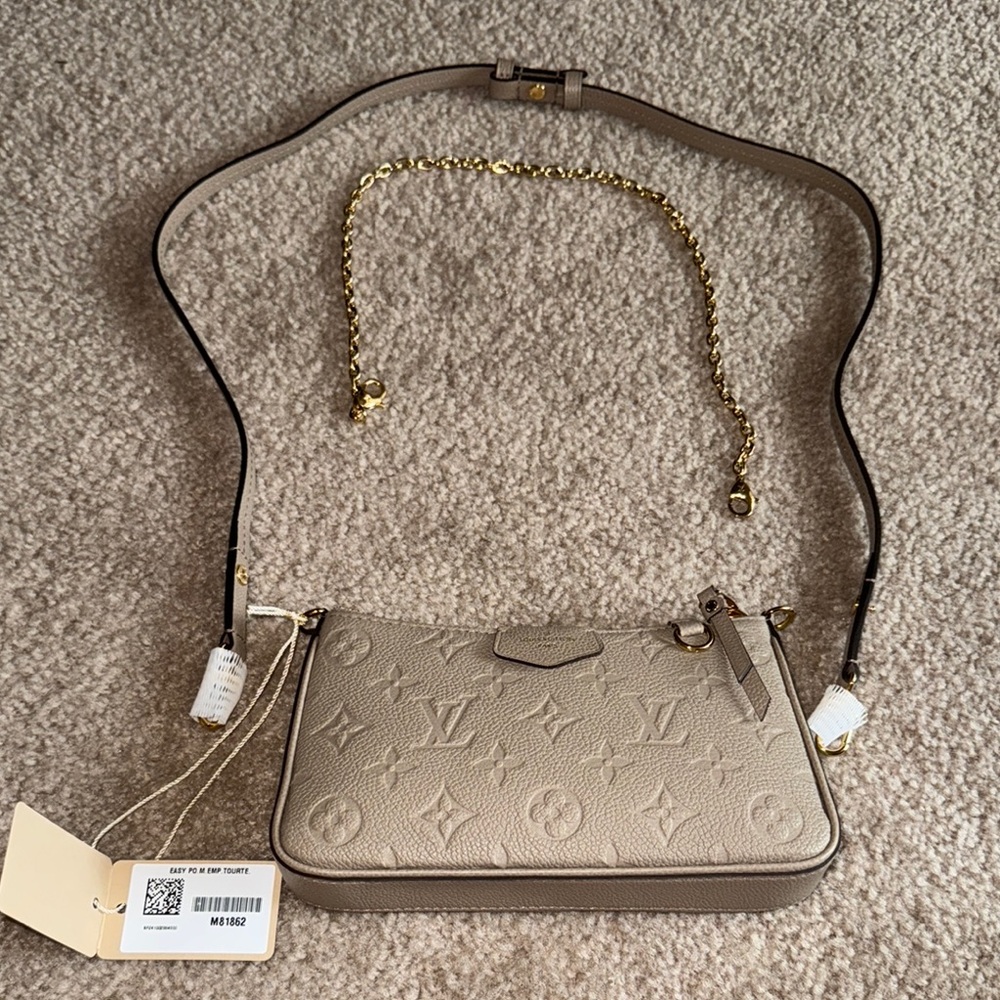 Louis Vuitton:
Easy Pouch On Strap in Turtledove